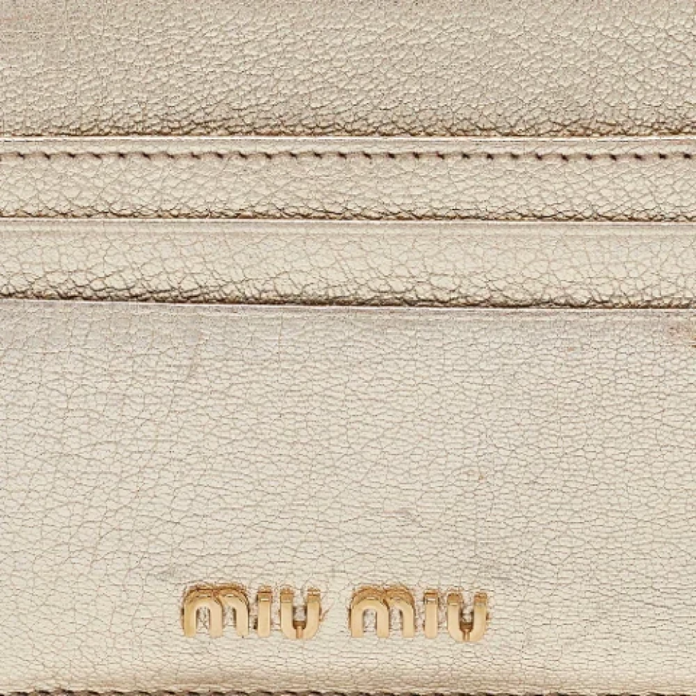 Miu Pre-owned Leather wallets Yellow Dames