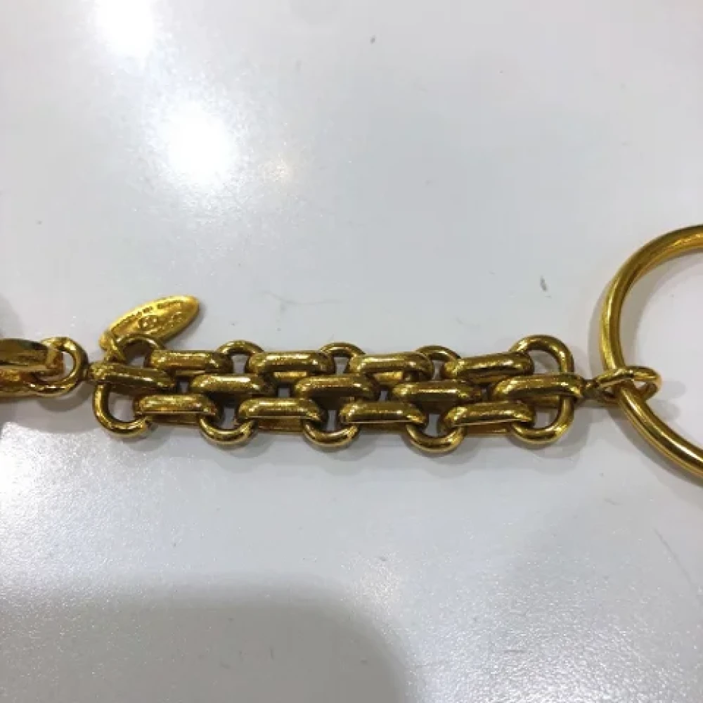 Chanel Vintage Pre-owned Metal key-holders Yellow Dames