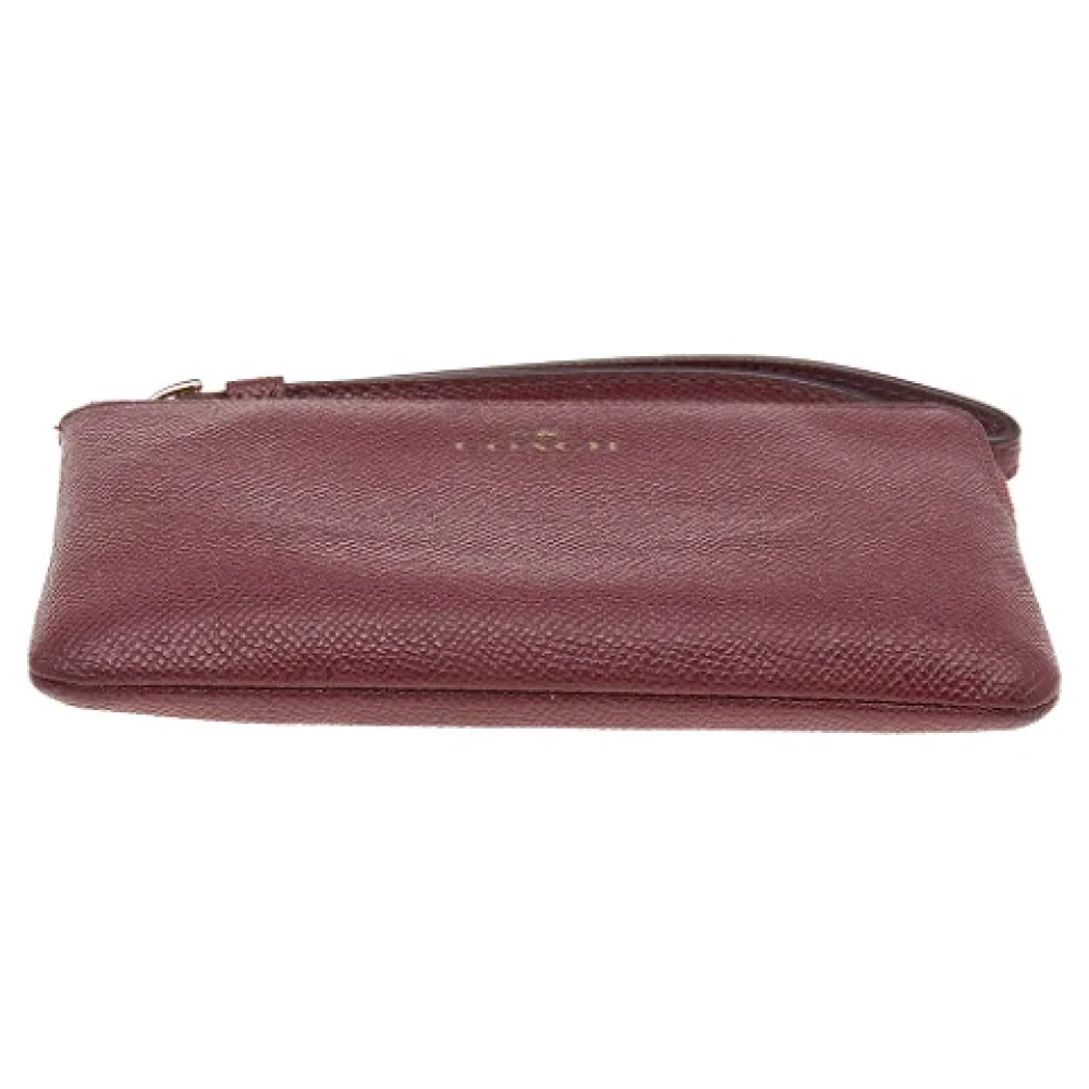 Coach Pre-owned Leather clutches Red Dames