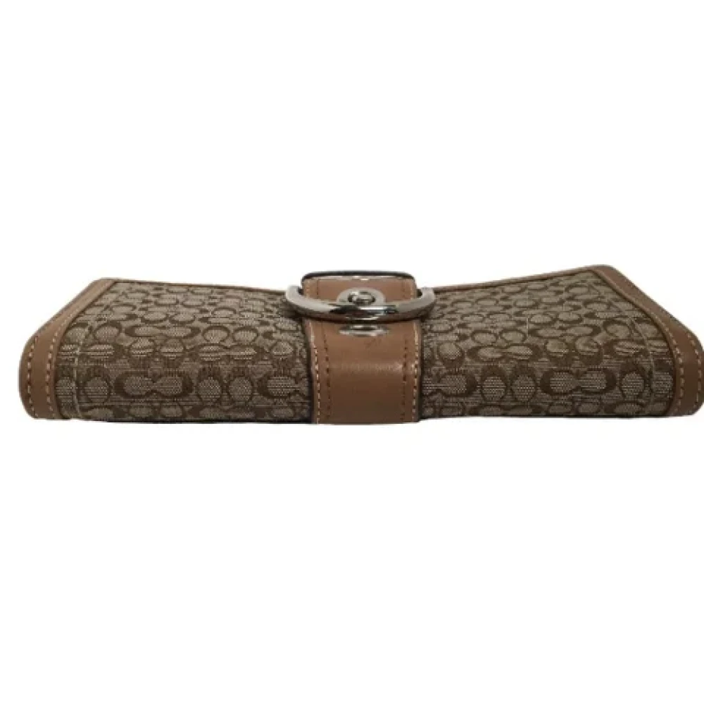 Coach Pre-owned Fabric clutches Brown Dames