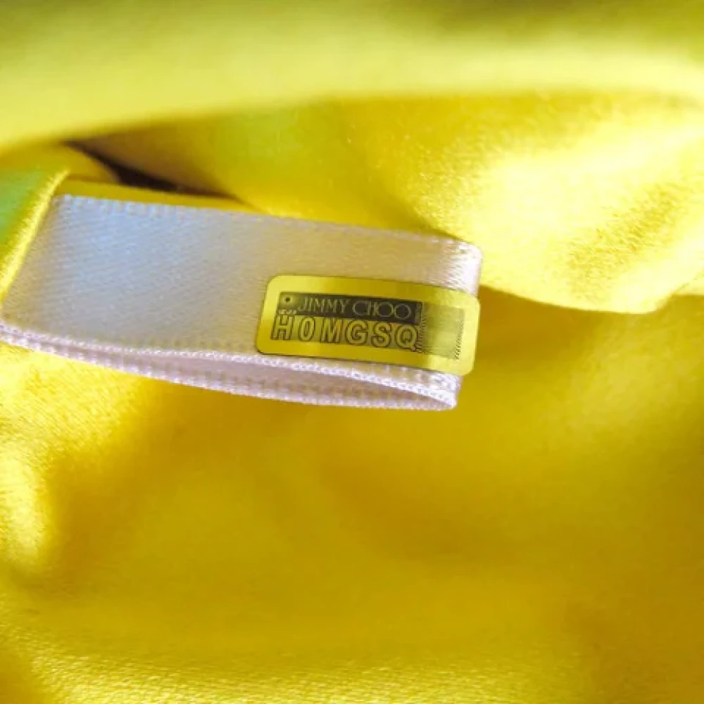 Jimmy Choo Pre-owned Satin clutches Yellow Dames