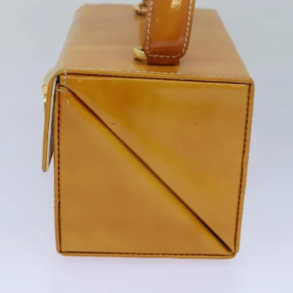 Salvatore Ferragamo Pre-owned Coated canvas handbags Yellow Dames