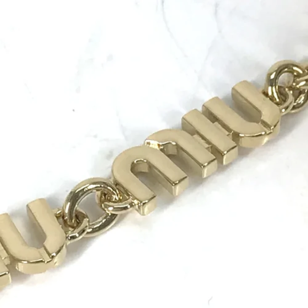 Miu Pre-owned Metal key-holders Yellow Dames