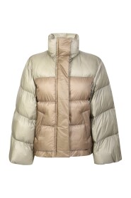 Down jacket with wide sleeve detail by Sacai. The brand has been described as influential in breaking down the dichotomy between casual and formal wear.