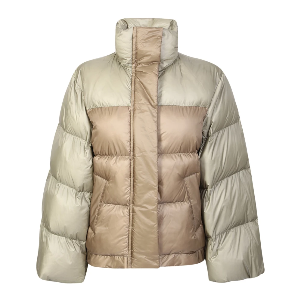 Down jacket with wide sleeve detail by Sacai. The brand has been described as influential in breaking down the dichotomy between casual and formal wear.