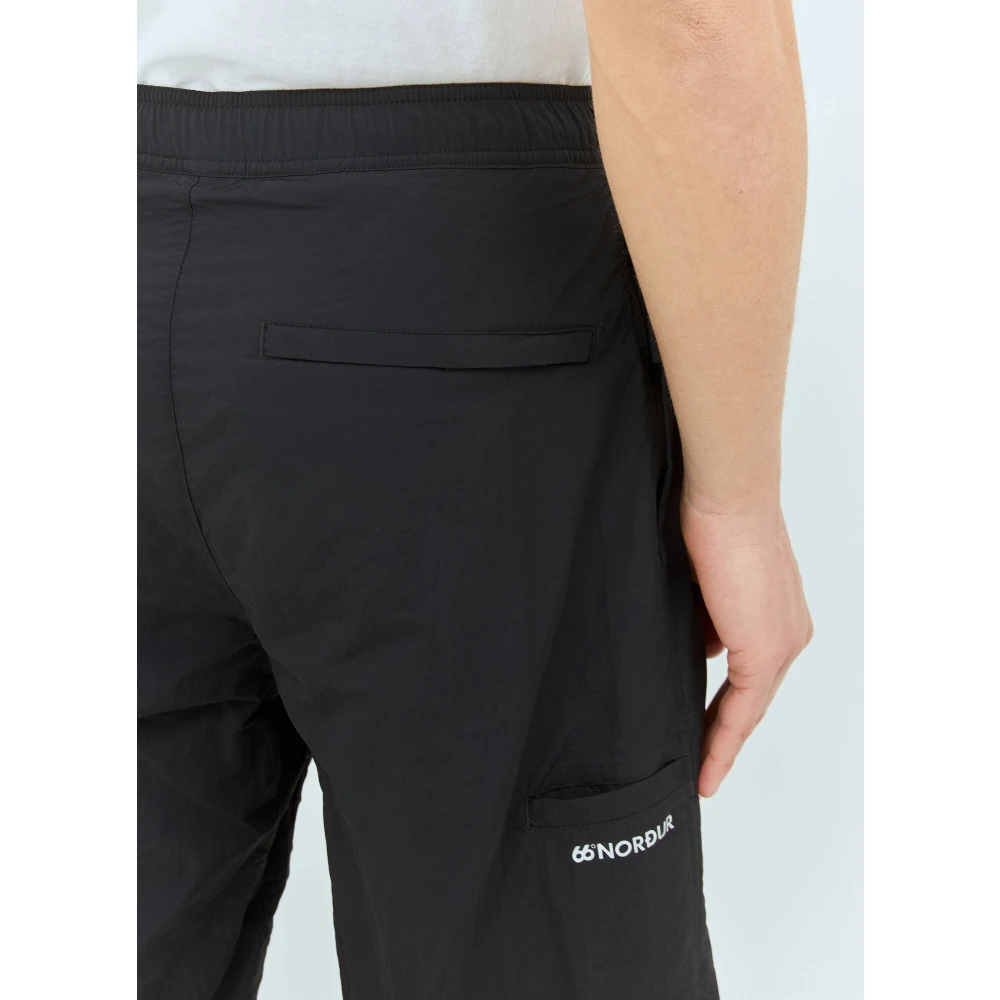 66 North Shell Weave Track Pants met Logo Black Heren