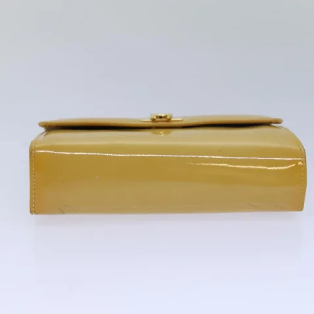 Salvatore Ferragamo Pre-owned Coated canvas handbags Yellow Dames