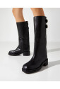 black-leather-knee-high-boots-with-decorative-buckles