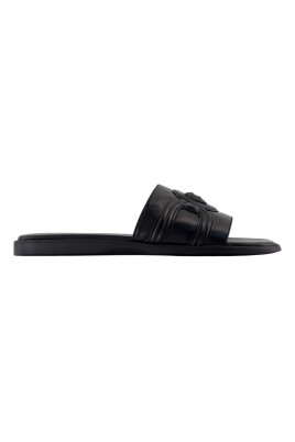 black-leather-sandals-with-brass-details