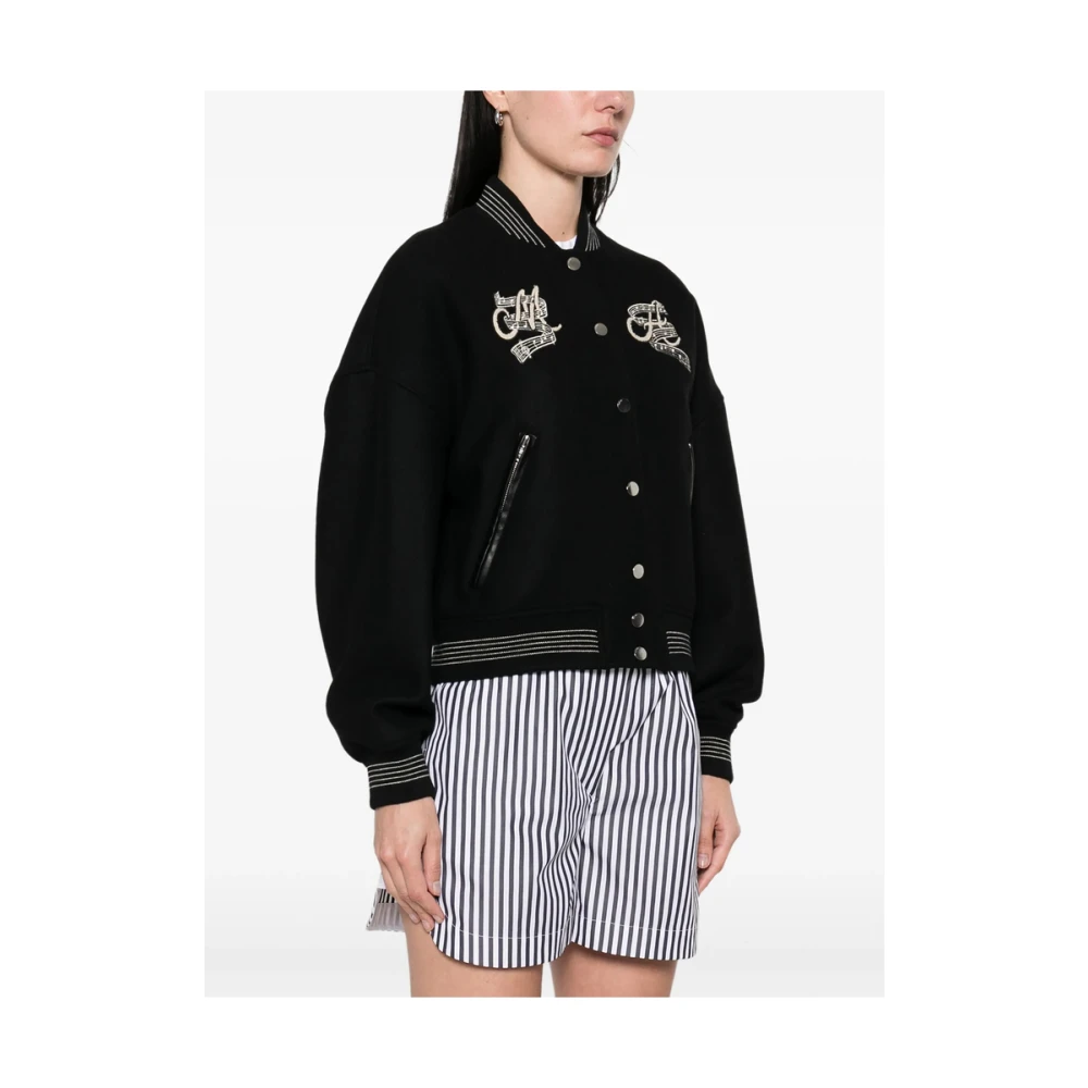 Amiri Zwart geribbeld bovenkleding met logoborduursel Black Dames