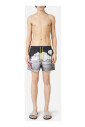 boxer-de-bain-a-motifs-avec-fond-noir-et-cordon-jaune