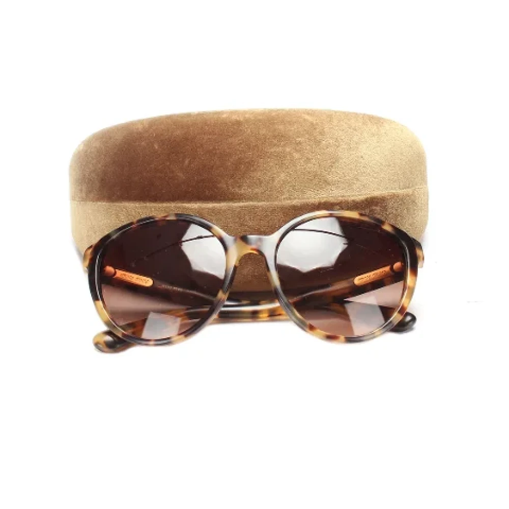 Miu Pre-owned Plastic sunglasses Brown Dames