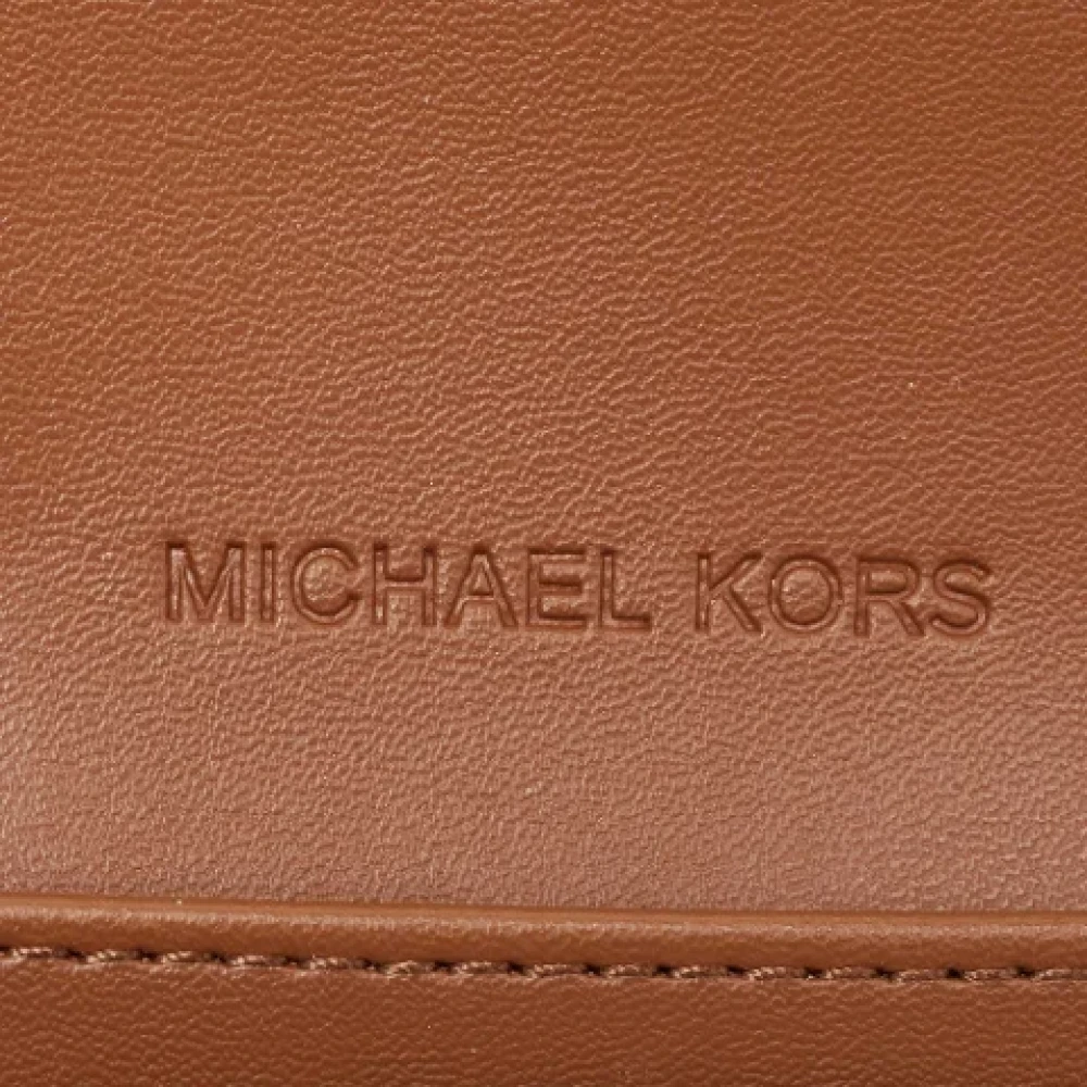 Michael Kors Pre-owned Coated canvas wallets Brown Dames