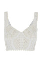 haut-blanc-avec-encolure-en-v-et-design-perfore