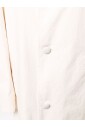 veste-en-coton-blanc-avec-un-bouton