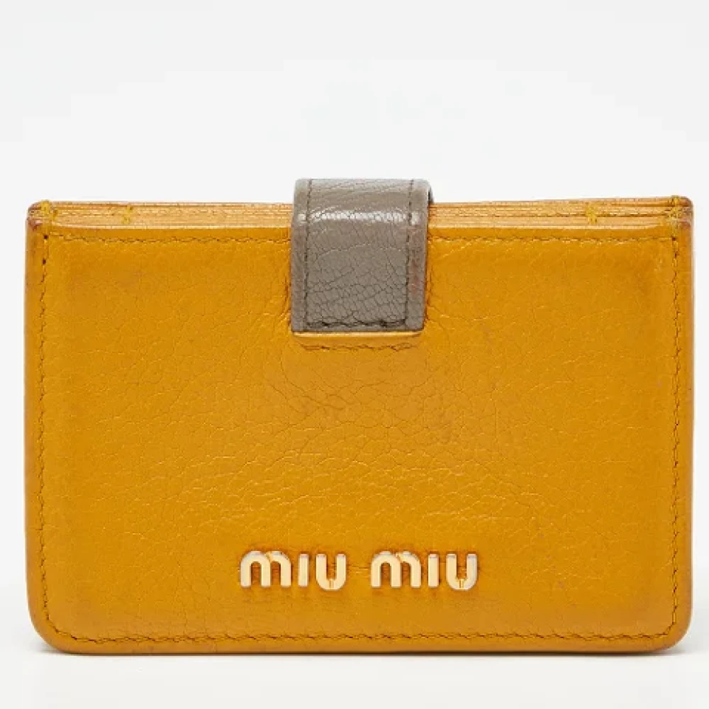 Miu Pre-owned Leather wallets Yellow Dames