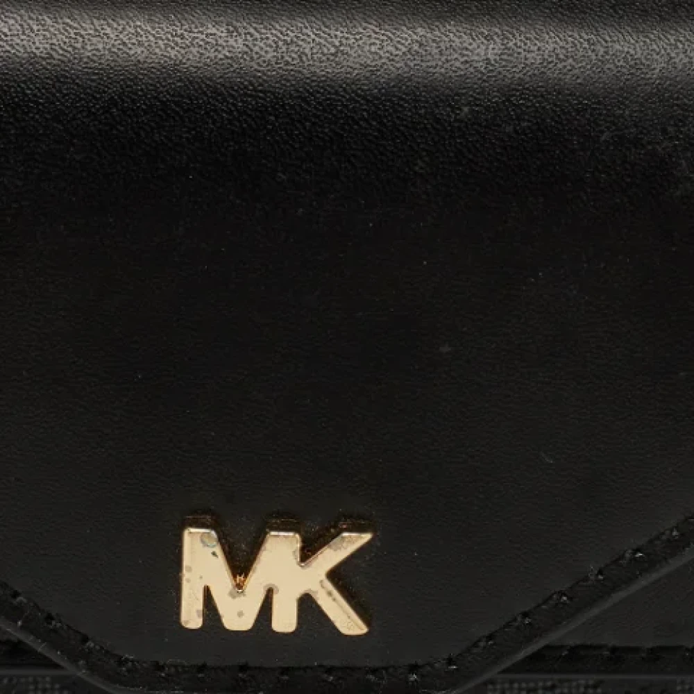 Michael Kors Pre-owned Coated canvas wallets Black Dames