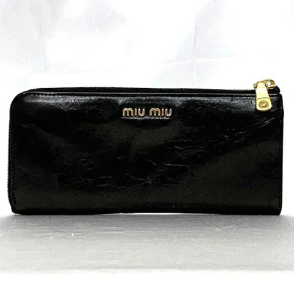 Miu Pre-owned Leather wallets Black Dames