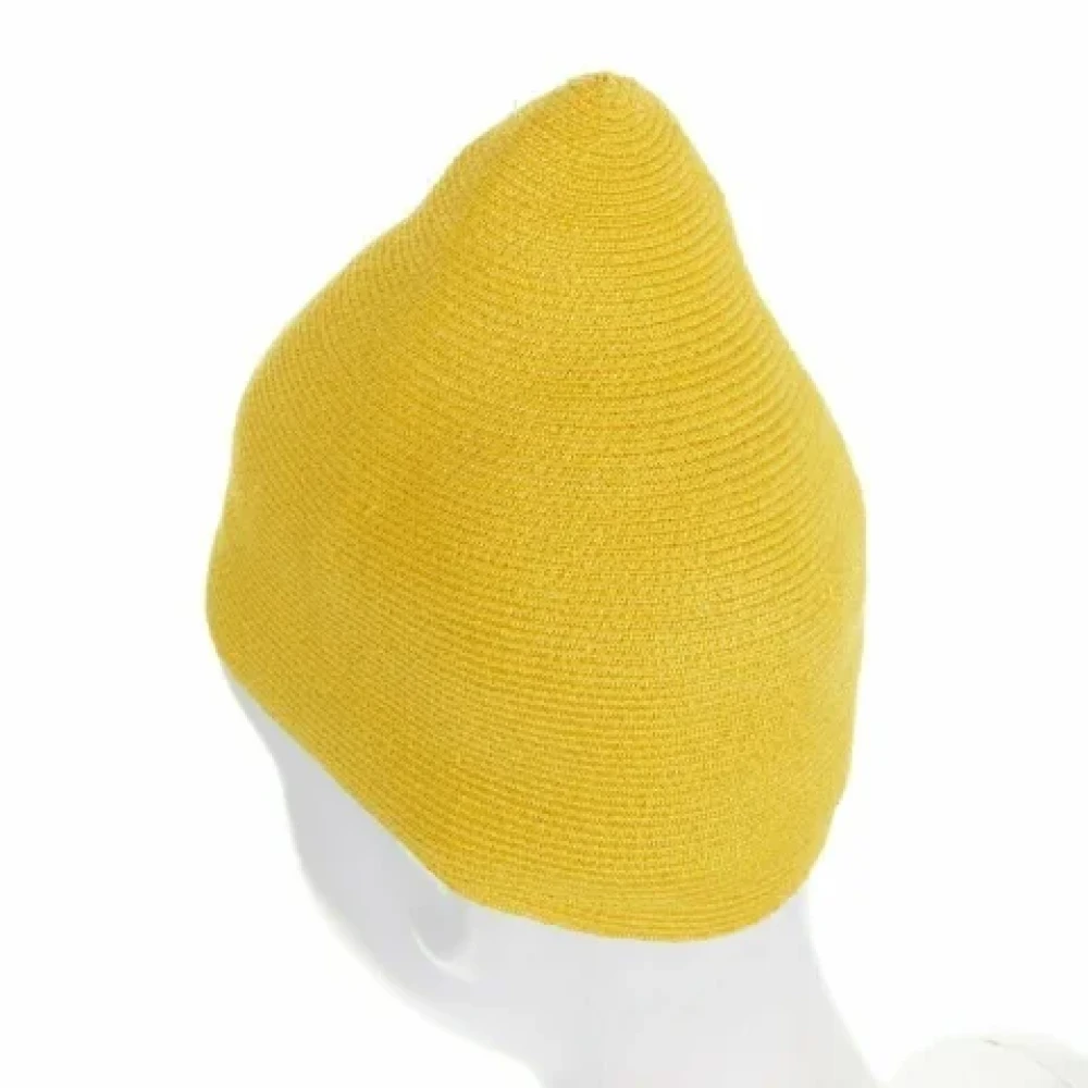 Issey Miyake Pre-owned Polyester hats Yellow Dames