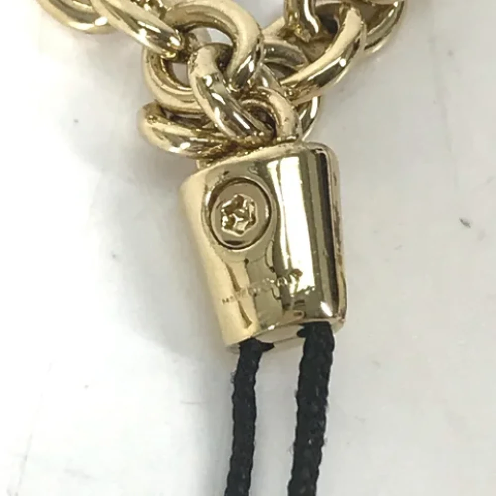 Miu Pre-owned Metal key-holders Yellow Dames