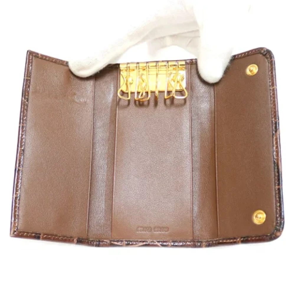 Miu Pre-owned Leather wallets Brown Dames