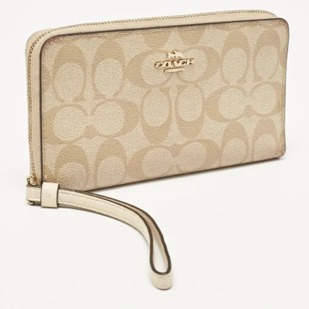 Coach Pre-owned Coated canvas wallets Beige Dames