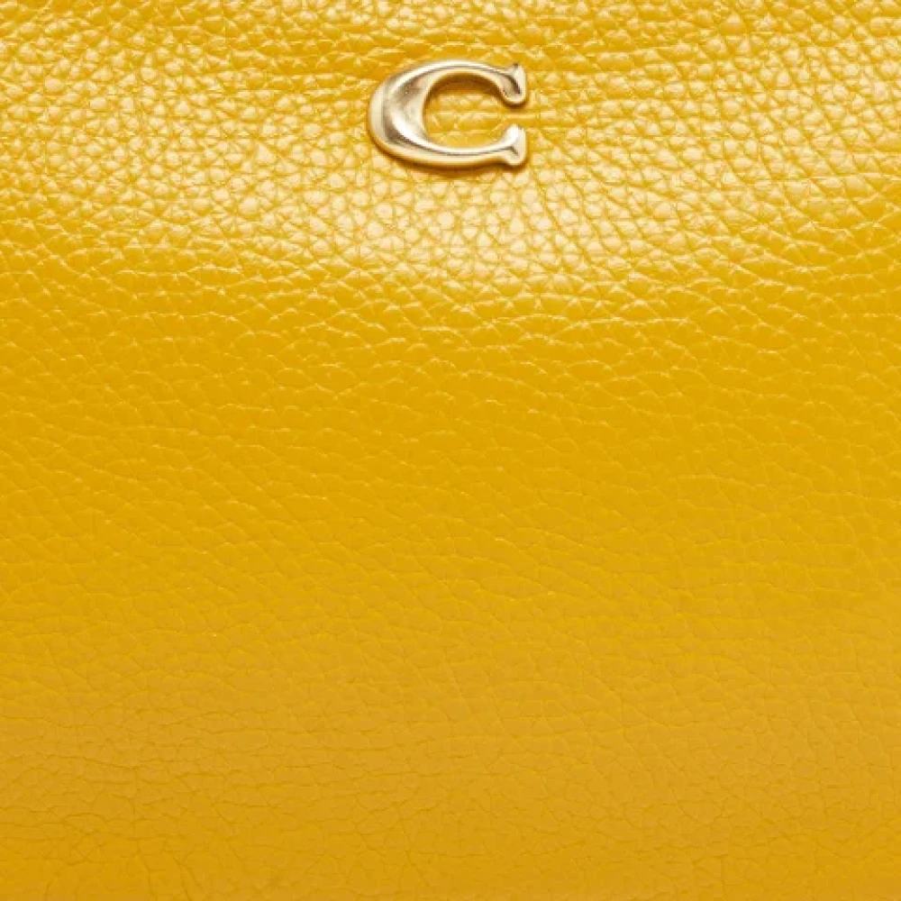 Coach Pre-owned Leather clutches Yellow Dames