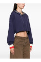 blue-sweater-with-gold-accents
