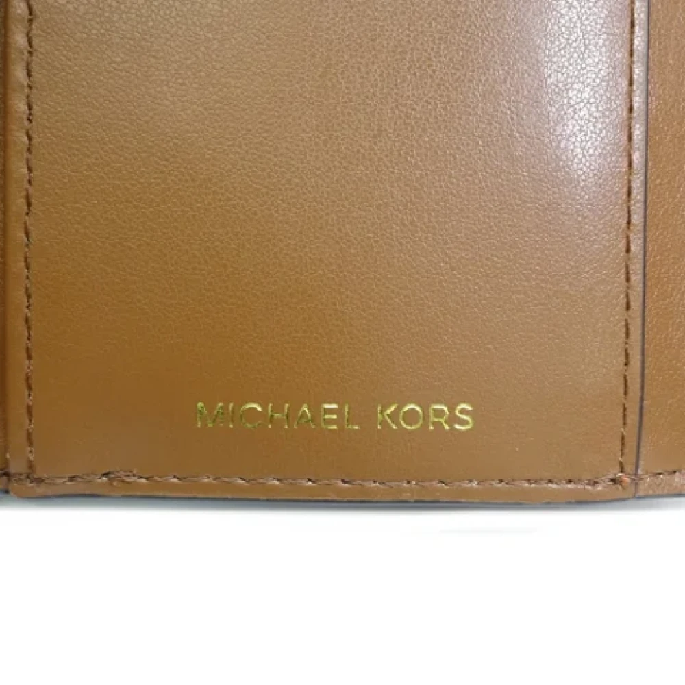 Michael Kors Pre-owned Canvas wallets Brown Dames