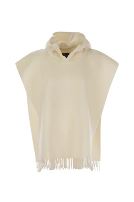 Dubbelstickad poncho i ull och kashmir med huva och fransar