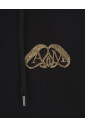 black-hoodie-with-gold-seal-applique