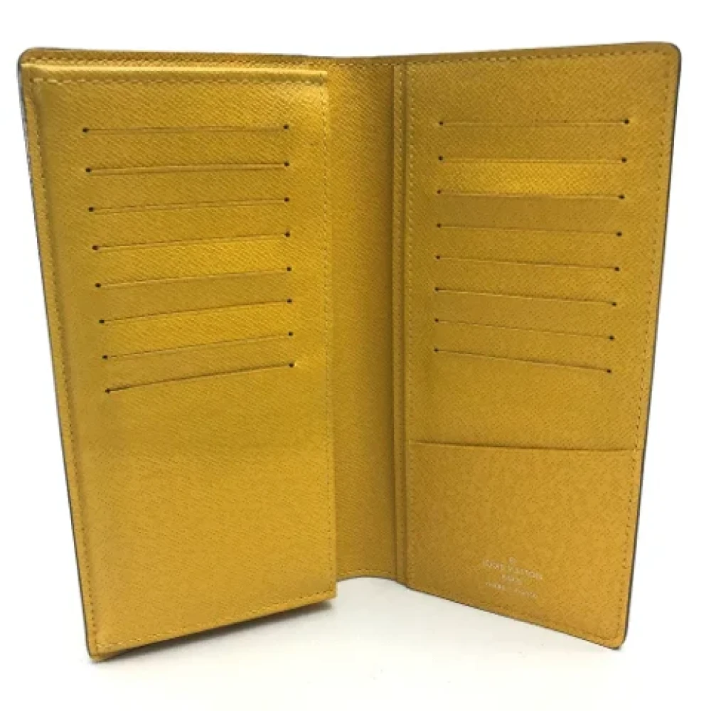 Louis Vuitton Vintage Pre-owned Leather wallets Yellow Heren