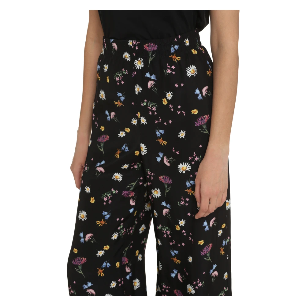 Stella Mccartney Zijden broek met bloemenprint Black Dames