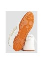 white-leather-sneakers-with-orange-sole