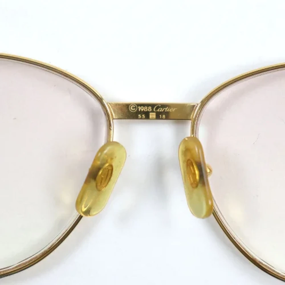 Cartier Vintage Pre-owned Metal sunglasses Yellow Dames