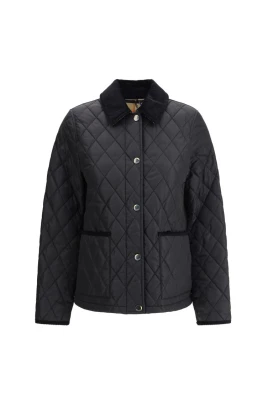 Quiltad jacka med corduroy-trim