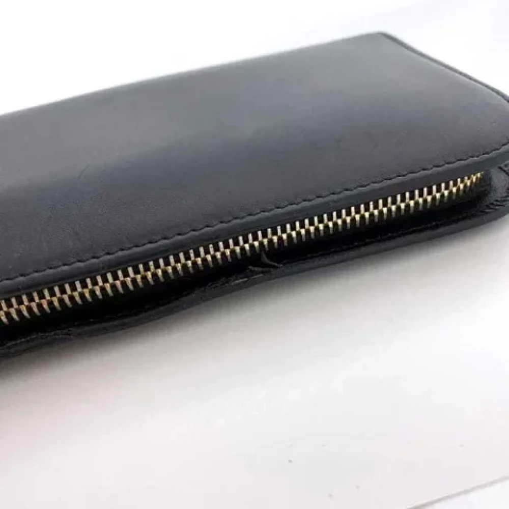 Yves Saint Laurent Vintage Pre-owned Leather wallets Black Dames