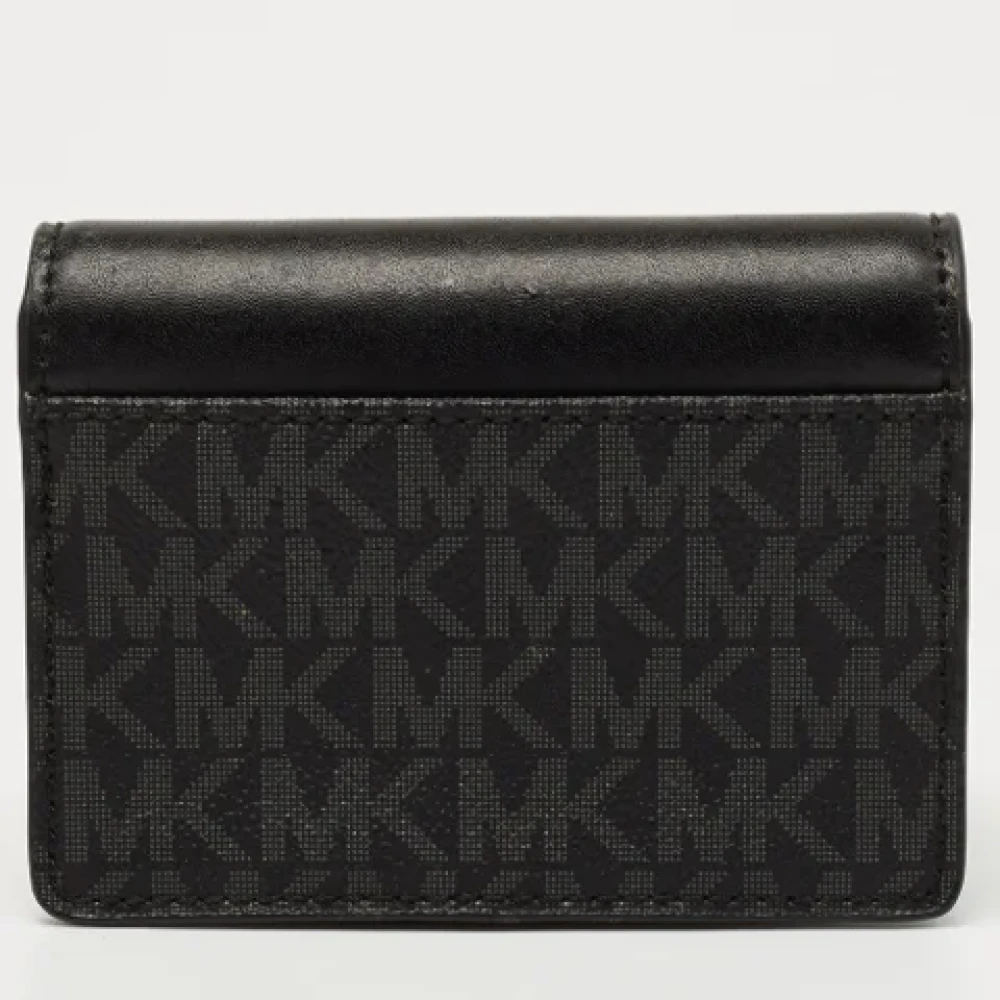 Michael Kors Pre-owned Coated canvas wallets Black Dames