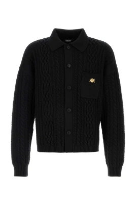 Stickad tröja i ull med blandade maskor