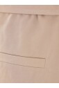 beige-elastiske-bukser-med-box-pleat-detalje