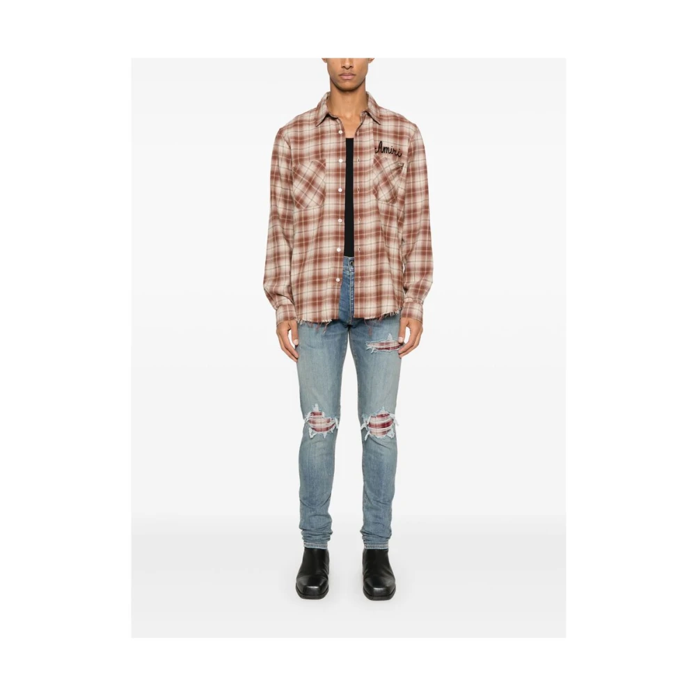 Amiri Lichtblauwe Ripped Jeans met knoopsluiting Blue Heren