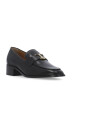 black-leather-loafers-with-metal-logo