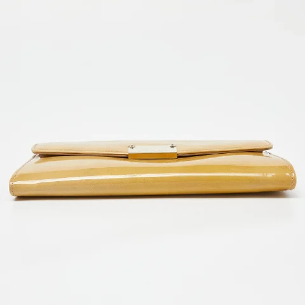 Jimmy Choo Pre-owned Leather clutches Beige Dames