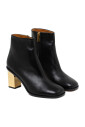 black-leather-ankle-boots-with-golden-heels