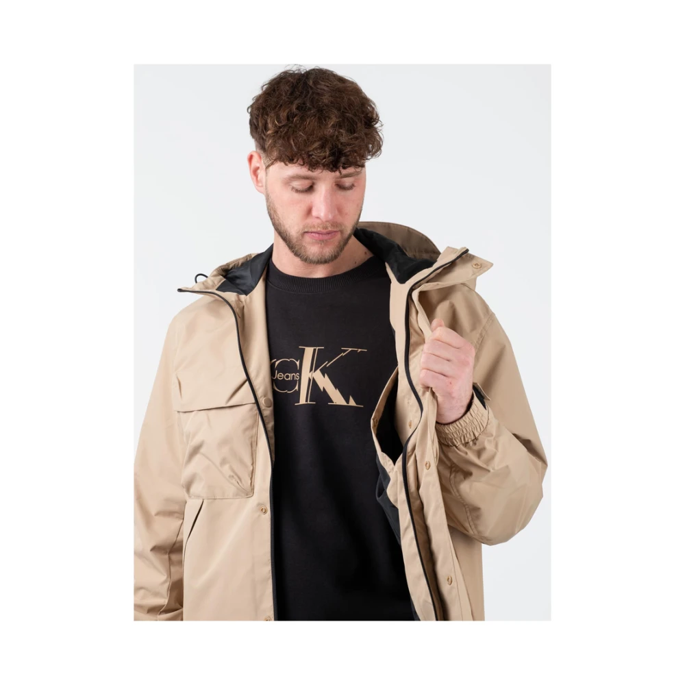 Calvin Klein Stijlvolle Jassen voor Mannen en Vrouwen Beige Heren