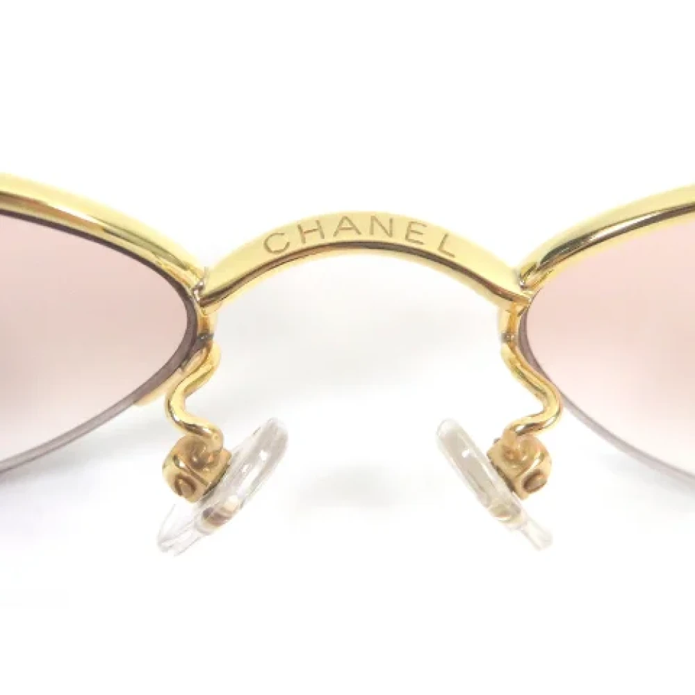 Chanel Vintage Pre-owned Metal sunglasses Yellow Dames