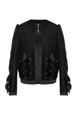 Blazer med skimrande applikationer