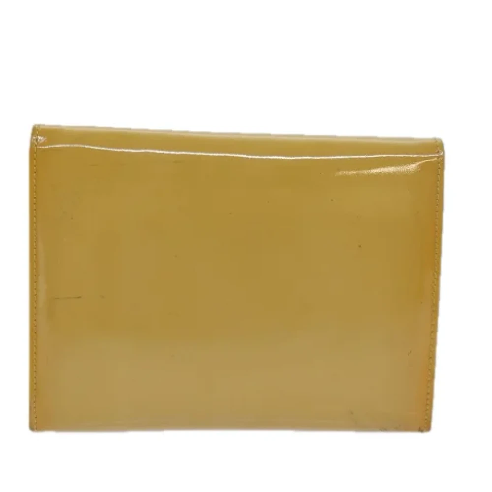 Salvatore Ferragamo Pre-owned Coated canvas handbags Yellow Dames