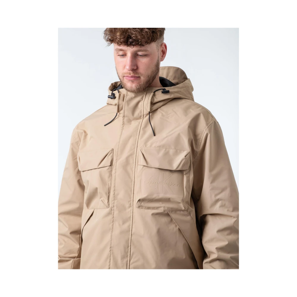 Calvin Klein Stijlvolle Jassen voor Mannen en Vrouwen Beige Heren