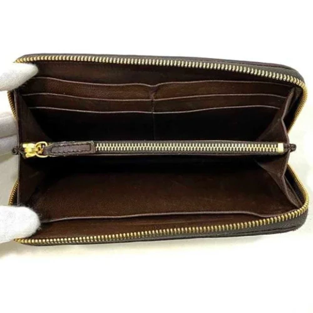 Miu Pre-owned Leather wallets Brown Dames